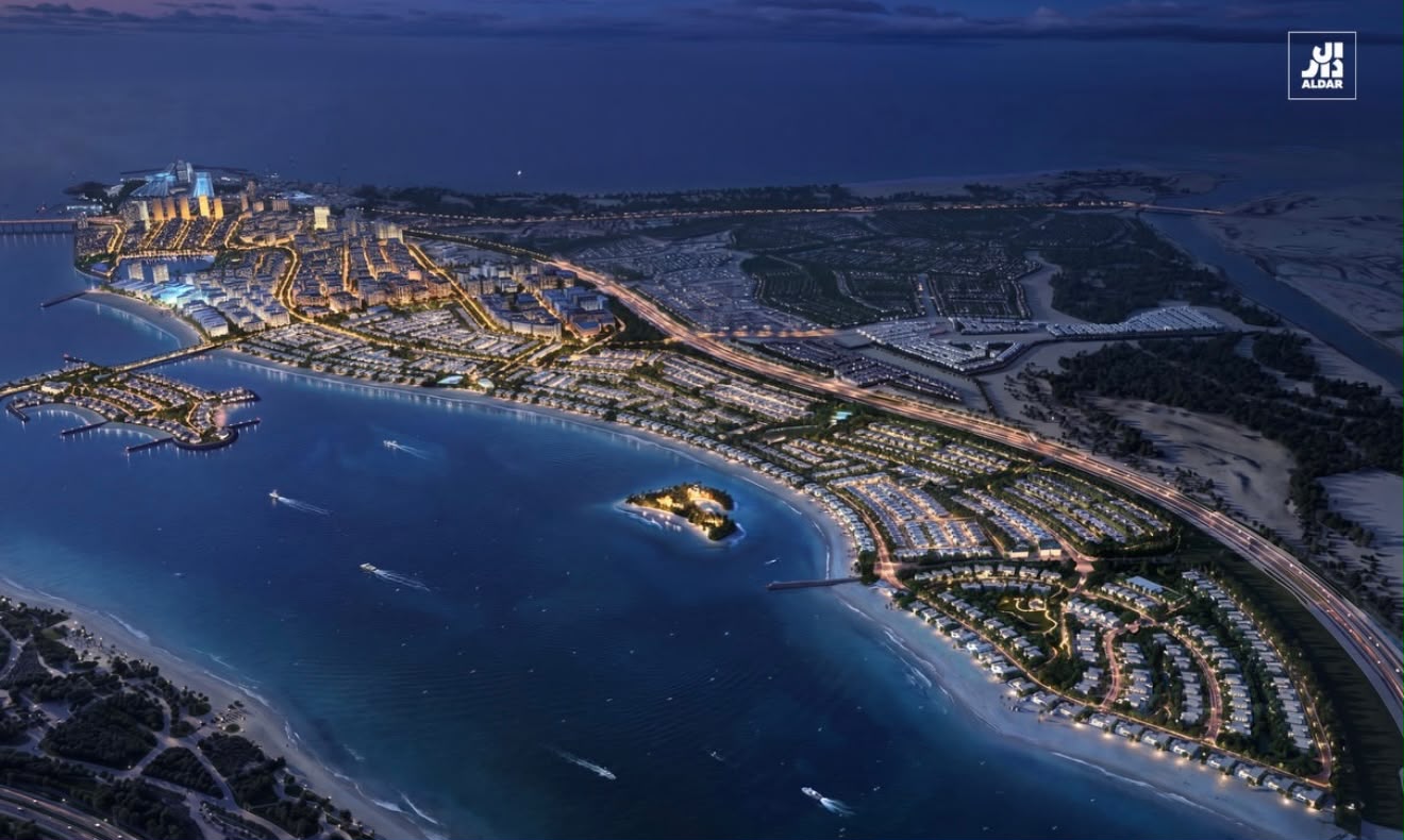 The Marsa Al Saadiyat masterplan at dusk, showing the marina, beaches and waterfront neighbourhoods